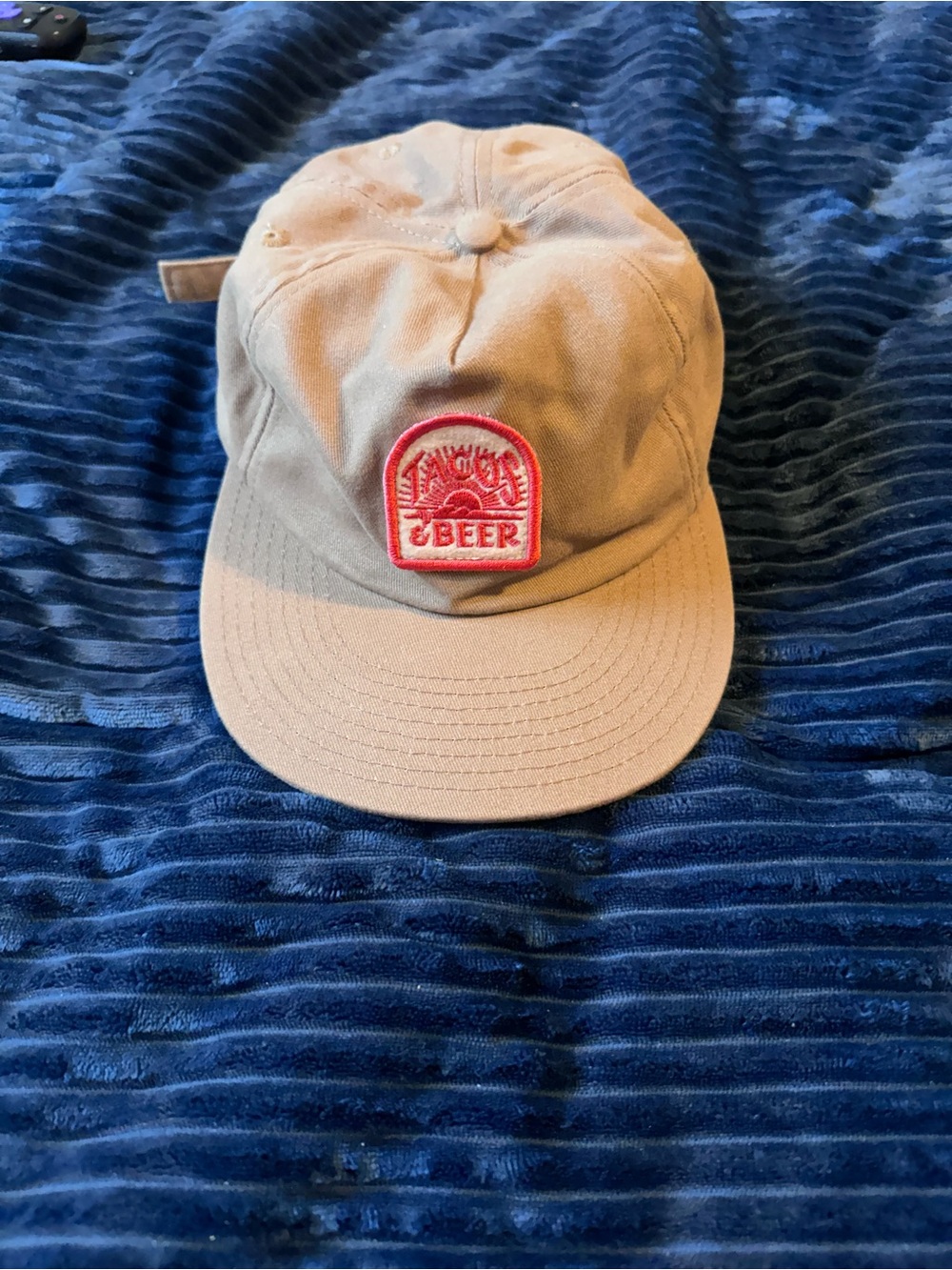 Tan Baseball Cap with Red Patch Logo